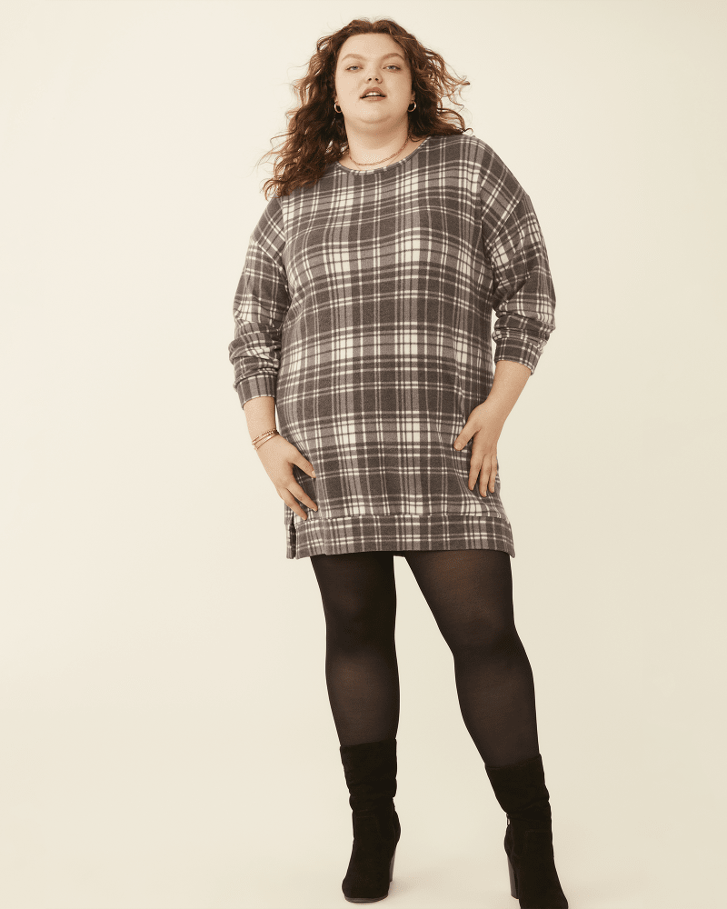 Front of 5'10.5" model wearing a plus size Fiona Crewneck Printed Sweater Dress in Black / White by Meri Skye. | dia_product_style_image_id:274237